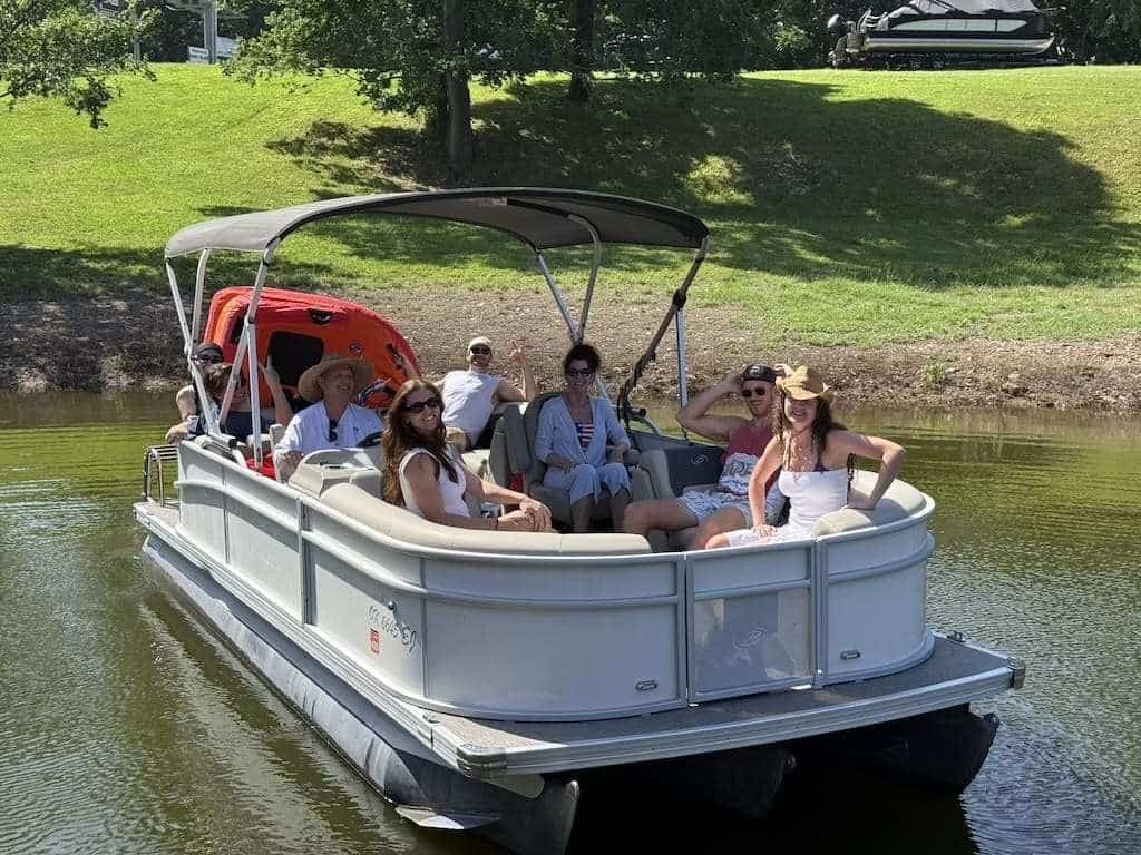 Guests enjoying a pontoon boat ride on Grand Lake