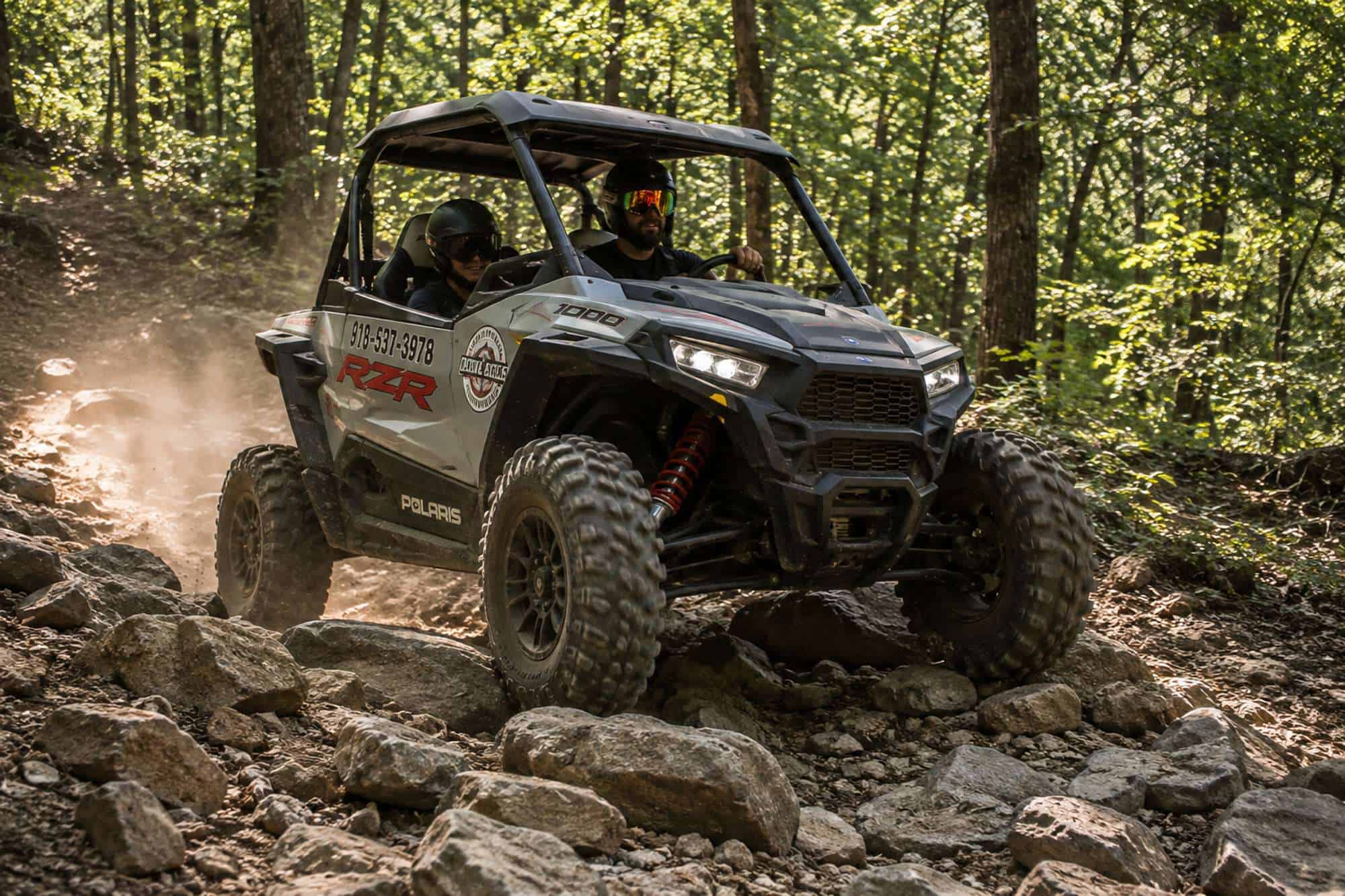 UTV navigating a rugged rocky section of the trail