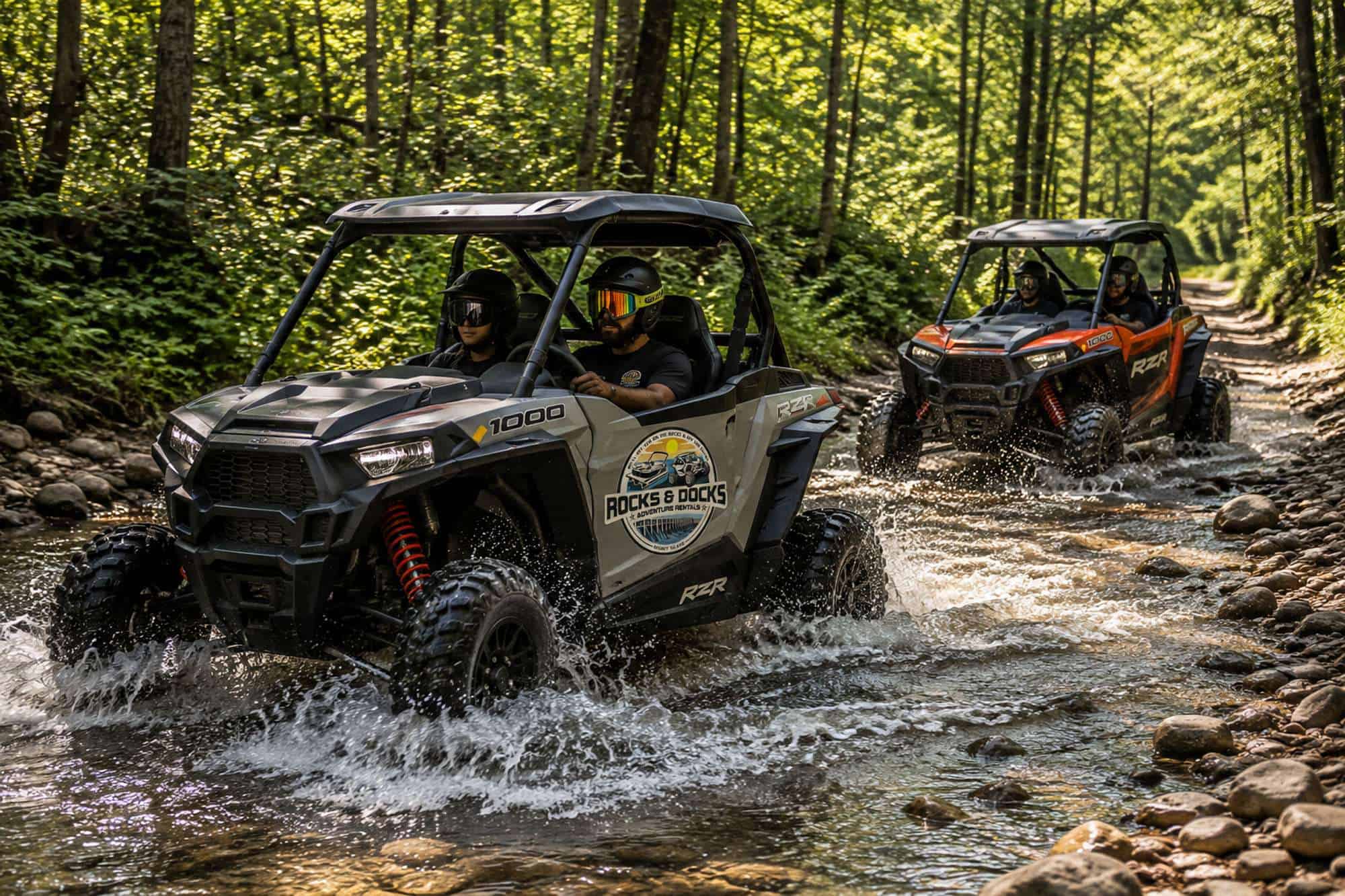 Polaris RZR crossing rocky terrain on a wooded trail