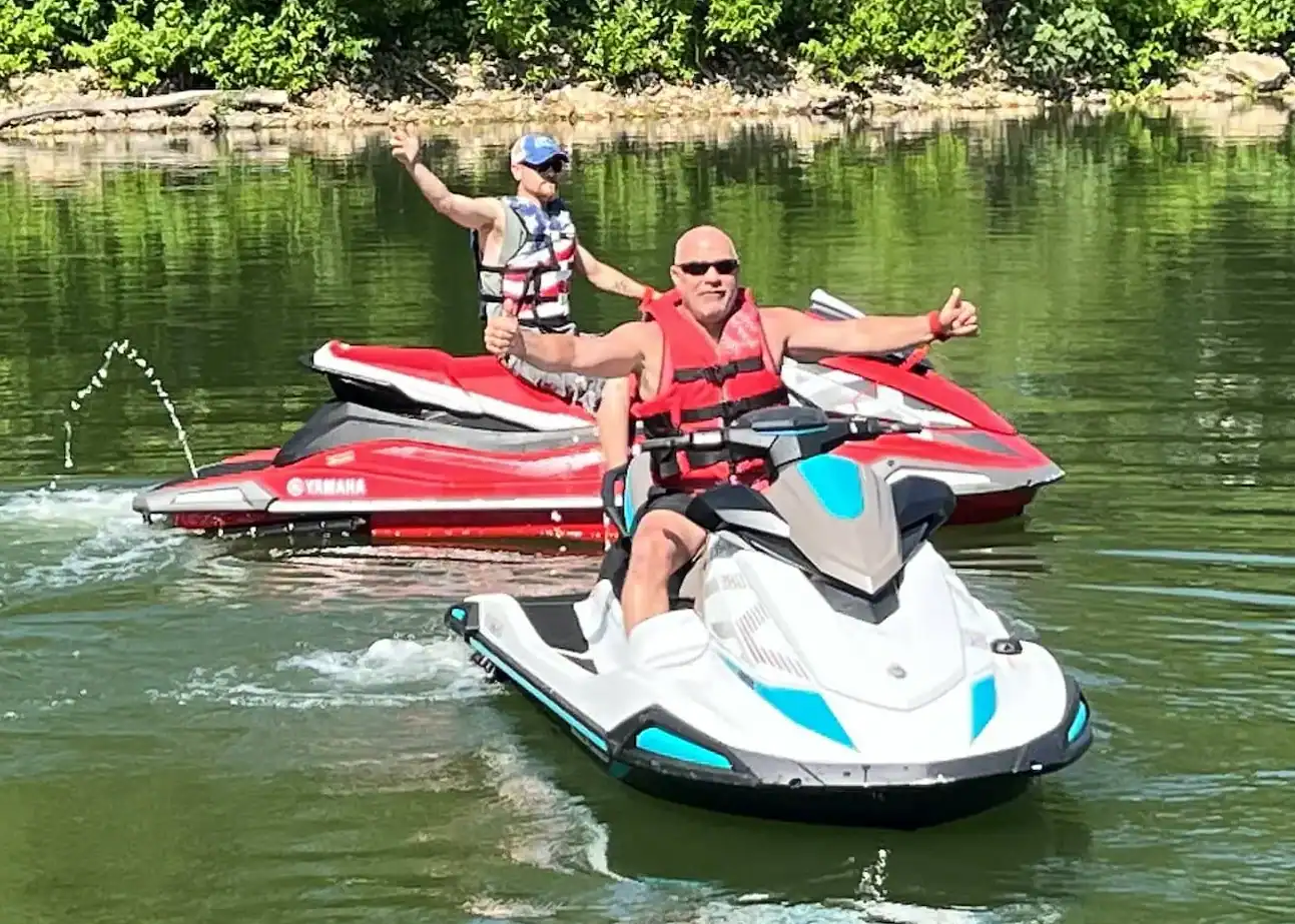 Two jet skis on the water during a Grand Lake outing